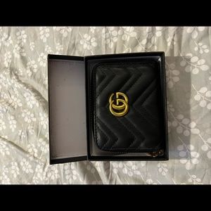 Black wallet with gold color logo- non designer